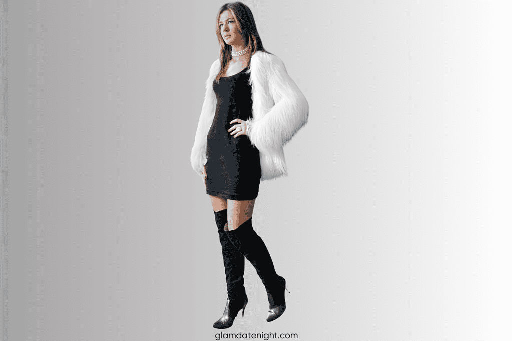 A chic midi dress layered with a velvet blazer and faux fur vest, creating a cozy yet sophisticated look perfect for a stylish fall or winter date night.